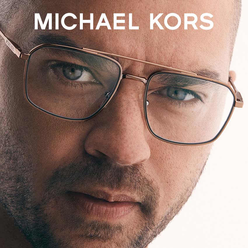 Man modeling Michael Kors glasses
